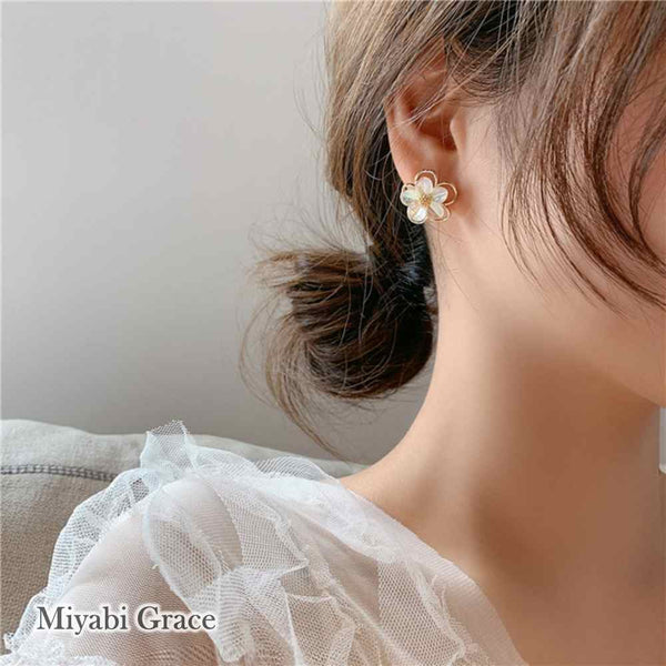 Large White Flower Coil Clip On Earrings