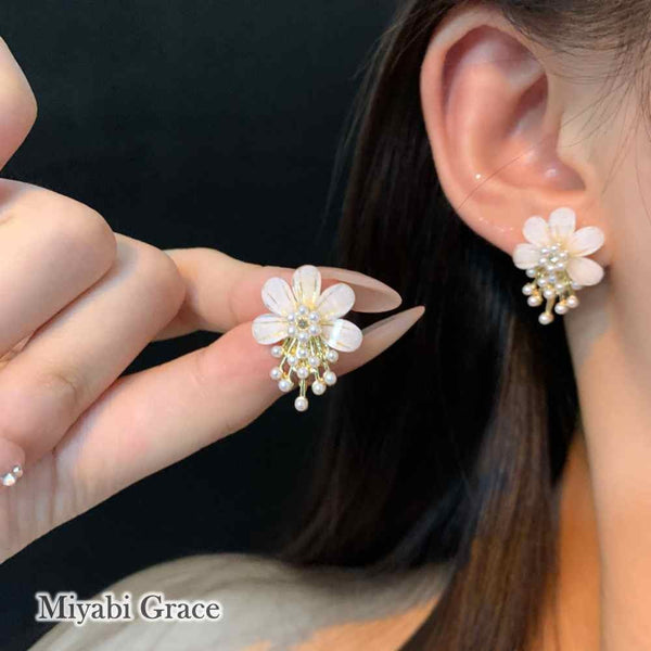 Large White Flower Coil Clip On Earrings