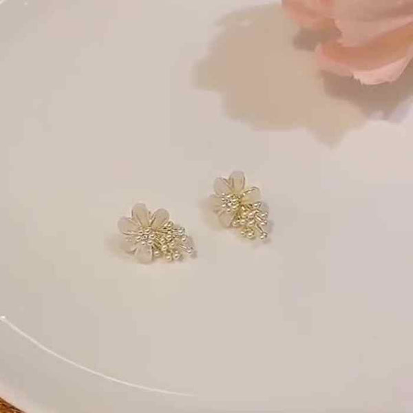 Large White Flower Coil Clip On Earrings