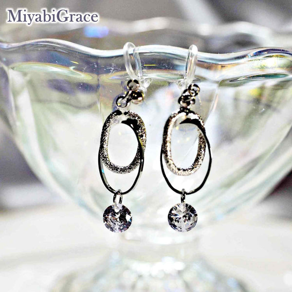 Double Oval Hoop with Cubic Zirconia Invisible Clip On Earrings