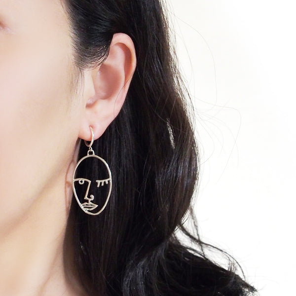 Silver Picasso human face clip on hoop earrings - Miyabi Grace